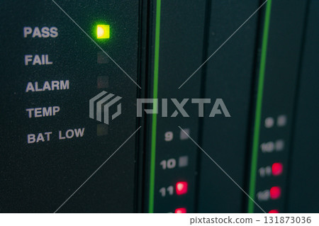 Green light is lit up on a black box that says PASS 131873036