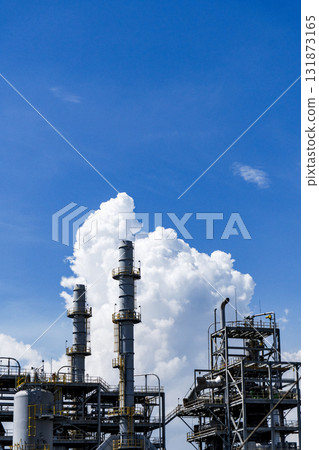 Large industrial plant with a large cloud in the sky Large industrial plant with a large cloud in the sky 131873165