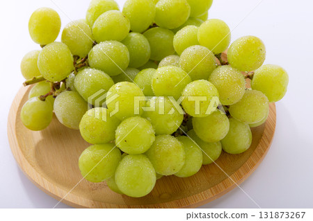 Shine Muscat grapes on a sieve Shine Muscat grapes on a sieve 131873267