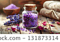 Glass jar filled with fresh blueberries and dried goji berries on a rustic wooden table. Natural light enhances the vibrant red and blue hues, symbolizing superfood nutrition and antioxidant wellness 131873314