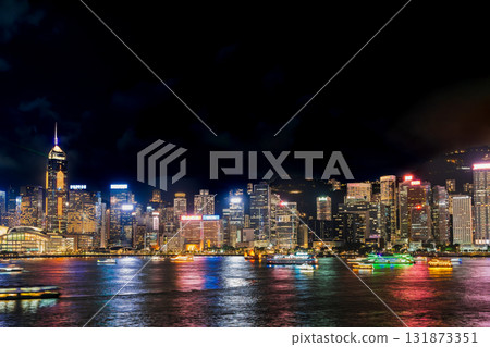 Hong Kong Victoria Harbour and sightseeing boats at night 131873351
