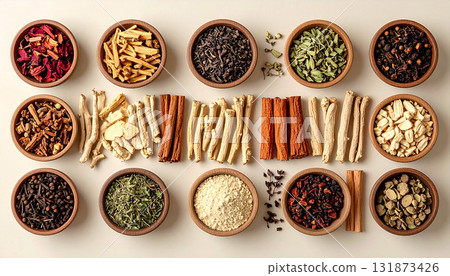 A neatly arranged flat lay of dried adaptogenic roots and herbs such as ashwagandha and rhodiola, displayed in small wooden bowls on a neutral background, symbolizing natural wellness and balance 131873426
