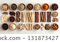 A neatly arranged flat lay of dried adaptogenic roots and herbs such as ashwagandha and rhodiola, displayed in small wooden bowls on a neutral background, symbolizing natural wellness and balance 131873427