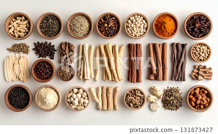 A neatly arranged flat lay of dried adaptogenic roots and herbs such as ashwagandha and rhodiola, displayed in small wooden bowls on a neutral background, symbolizing natural wellness and balance 131873427