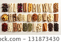 A neatly arranged flat lay of dried adaptogenic roots and herbs such as ashwagandha and rhodiola, displayed in small wooden bowls on a neutral background, symbolizing natural wellness and balance 131873430