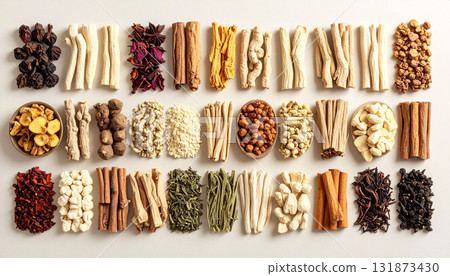 A neatly arranged flat lay of dried adaptogenic roots and herbs such as ashwagandha and rhodiola, displayed in small wooden bowls on a neutral background, symbolizing natural wellness and balance 131873430