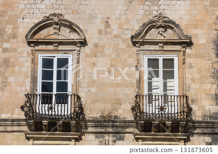 Baroque windows detail in Sicily Italian building Baroque windows detail in Sicily Italian building 131873605