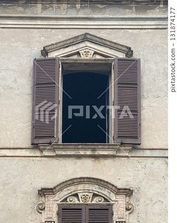 Traditional window of Italian buildigns with closing doors in wood 131874177