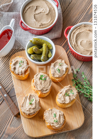 Turkey liver pate on toast with cornichons and cranberry sauce beside Turkey liver pate on toast with cornichons and cranberry sauce beside 131874516