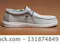 Side view of gray shoe 131874849