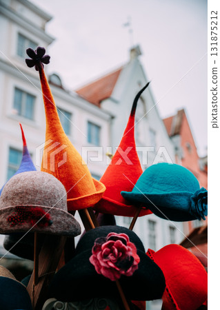 Tallinn, Estonia, Europe. Traditional Christmas Winter Market With Warm Hats. Colorful Traditional European Warm Clothes. Xmas Souvenir From Europe. Tallinn, Estonia, Europe. Traditional Christmas Winter Market With Warm Hats. Colorful Traditional European Warm Clothes. Xmas Souvenir From Europe. 131875212
