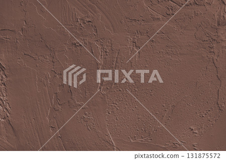 Close up brown colored painted plaster wall surface background with rough brushstrokes texture Close up brown colored painted plaster wall surface background with rough brushstrokes texture 131875572