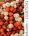 Fresh red and white radishes stacked in a pile creating a natural vegetable background, perfect for 131875741