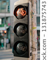 Red bicycle traffic light glowing in city street, symbol of safety, cycling, and modern urban 131875743