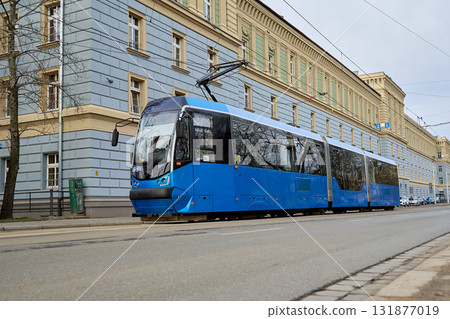 Modern blue tram on city street 131877019