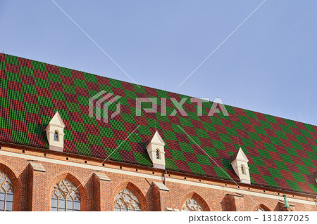 Gothic building roof with colorful patterned tiles Gothic building roof with colorful patterned tiles 131877025