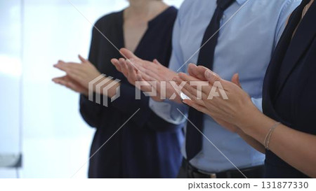 Business people are clapping hands, expressing gratitude and acknowledging a successful performance or presentation, creating a positive and encouraging atmosphere in a professional setting Business people are clapping hands, expressing gratitude and acknowledging a successful performance or presentation, creating a positive and encouraging atmosphere in a professional setting 131877330