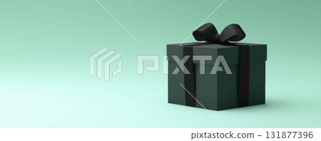 Black gift box on green color background. Long panoramic horizontal banner with large free space for text. Closed matte paper product box template tied with black ribbon and bow. Luxury present. Shop 131877396