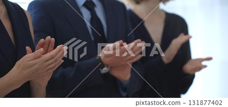 Business people are clapping hands, expressing gratitude and acknowledging a successful performance or presentation, creating a positive and encouraging atmosphere in a professional setting 131877402