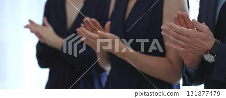 Business people hands clapping, showing applause and appreciation for success and achievement during a corporate event or conference meeting in office Business people hands clapping, showing applause and appreciation for success and achievement during a corporate event or conference meeting in office 131877479