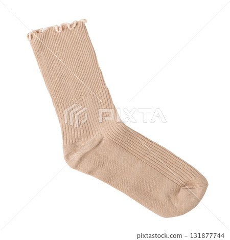 Beige ribbed sock with ruffled edge on black background Beige ribbed sock with ruffled edge on black background 131877744