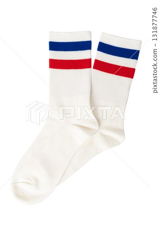 White socks with red and blue stripes on black background 131877746