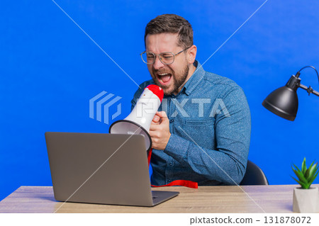 Man arguing talking on laptop conversation by webcam, quarrels, expresses a problem with employees 131878072
