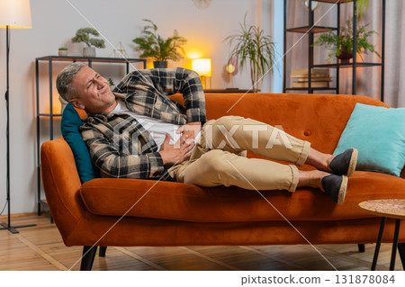 Man having symptom poisoning diarrhea indigestion peptic ulcer pancreatitis stomach ache gastritis 131878084