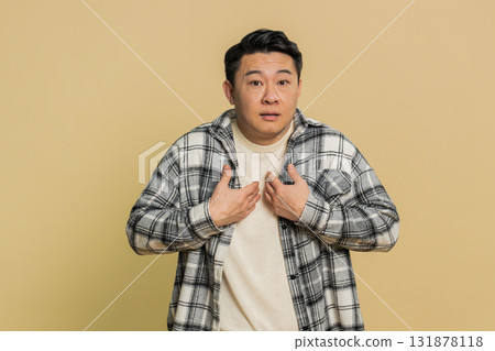 Asian man being uninvolved, clueless face expression, feels innocent, not his fault, fail mistake 131878118