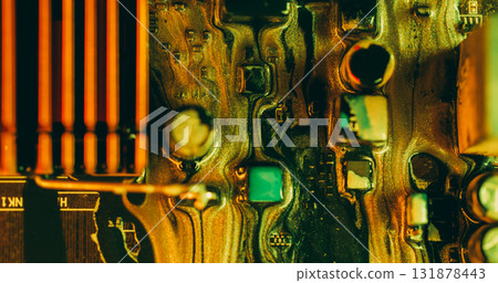 Paint spill. Electronic board. Defocused green orange yellow color glitter acrylic liquid microchip wet texture flow on abstract art background. Paint spill. Electronic board. Defocused green orange yellow color glitter acrylic liquid microchip wet texture flow on abstract art background. 131878443