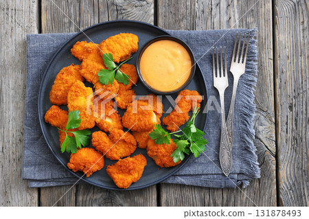 breaded chicken breast chunks with dipping sauce breaded chicken breast chunks with dipping sauce 131878493