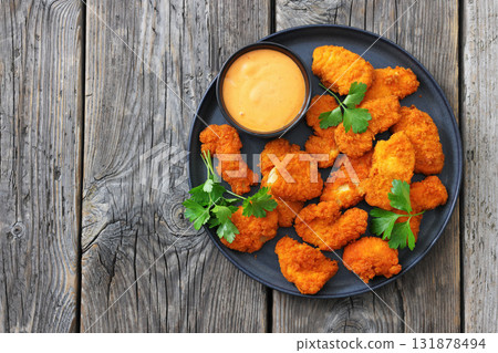 breaded chicken breast chunks with dipping sauce breaded chicken breast chunks with dipping sauce 131878494