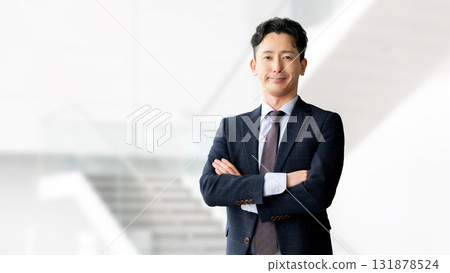 Male businessman folding his arms 131878524