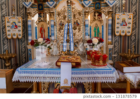 Detailed Interior of Eastern Orthodox Church Altar with Icons, Gold Textiles, and Royal Doors, Vibrant Spiritual Scene. 131878579
