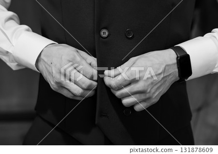 Groom Buttoning Vest Black Tie Wedding Preparation: A Sophisticated Moment Capturing Formal Attire and Classic Style Groom Buttoning Vest Black Tie Wedding Preparation: A Sophisticated Moment Capturing Formal Attire and Classic Style 131878609
