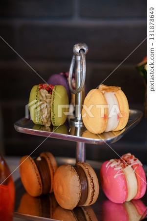Delectable Macaron Tower Display: French Pastries, Colorful Sweets, Metal Tiered Stand, Gourmet Dessert, Rich Textures, Appetizing Showcase Delectable Macaron Tower Display: French Pastries, Colorful Sweets, Metal Tiered Stand, Gourmet Dessert, Rich Textures, Appetizing Showcase 131878649
