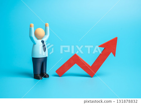 A businessman is pleased with the growth arrow. Increased profits and growing sales. An optimistic forecast. Business expansion, economic recovery, and positive market dynamics 131878832