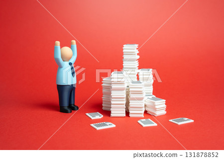 An office worker is terrified by the accumulated paperwork. Heavy workload. Bureaucracy and officials. Job stress, burnout, and excessive regulation. 131878852