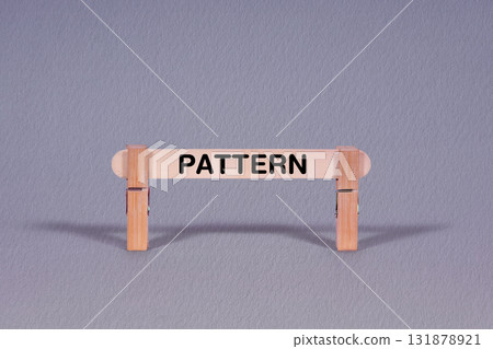 Pattern symbol. Single Wooden stick restrained by Clothespins, beautiful Gray Background. Business and Pattern concept with copy space 131878921