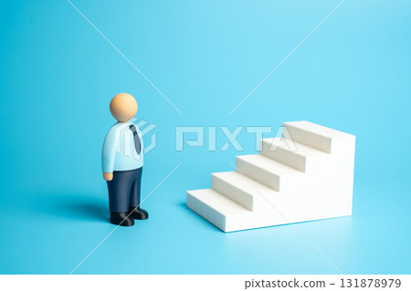 An office worker looks up a ladder. Concept: mastering skills. Starting a new career from the bottom. Fulfilling all requirements for promotion. Ambition, career development. HR, motivation, education An office worker looks up a ladder. Concept: mastering skills. Starting a new career from the bottom. Fulfilling all requirements for promotion. Ambition, career development. HR, motivation, education 131878979