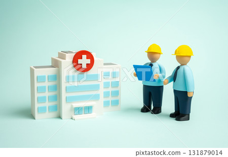 Builders are finishing building the hospital. Opening of new medical institutions, modernization and reconstruction. Public health infrastructure, investment in healthcare, urban development projects. Builders are finishing building the hospital. Opening of new medical institutions, modernization and reconstruction. Public health infrastructure, investment in healthcare, urban development projects. 131879014