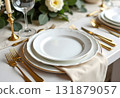 Spring minimalist table setting in warm neutral colors. Easter festive table decoration, white plates, gold cutlery, candles, eggs and willow branches in vase 131879057