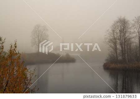 Beautiful natural backdrop with thick fog over the lake. Beautiful natural backdrop with thick fog over the lake. 131879633