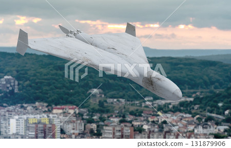 A drone in the sky above a megalopolis. Top view of the city landscape. A drone in the sky above a megalopolis. Top view of the city landscape. 131879906