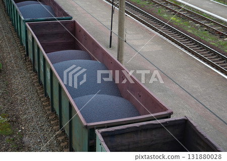 Freight train car with iron ore pellets Freight train car with iron ore pellets 131880028