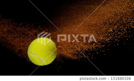 Freeze Motion Shot of Flying Tennis Ball with Clay , Isolated on Black Background 131880108