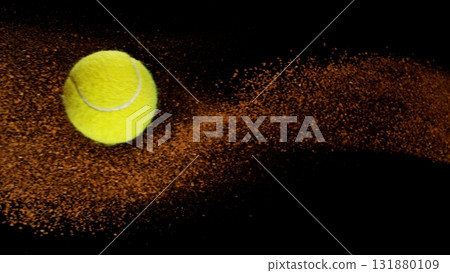 Freeze Motion Shot of Flying Tennis Ball with Clay , Isolated on Black Background 131880109