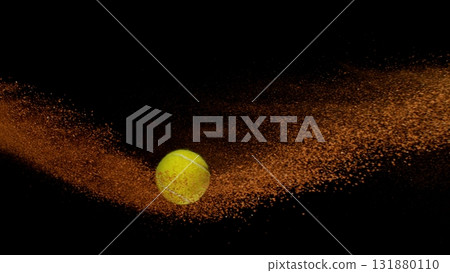 Freeze Motion Shot of Flying Tennis Ball with Clay , Isolated on Black Background 131880110