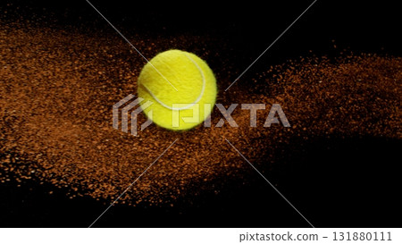 Freeze Motion Shot of Flying Tennis Ball with Clay , Isolated on Black Background 131880111