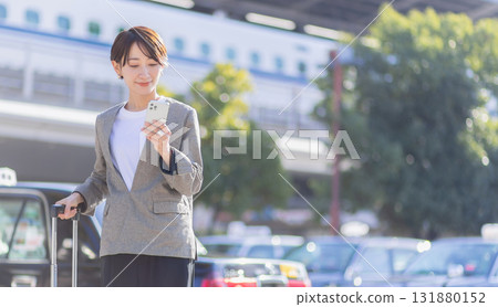 Business woman with a smartphone Business woman with a smartphone 131880152